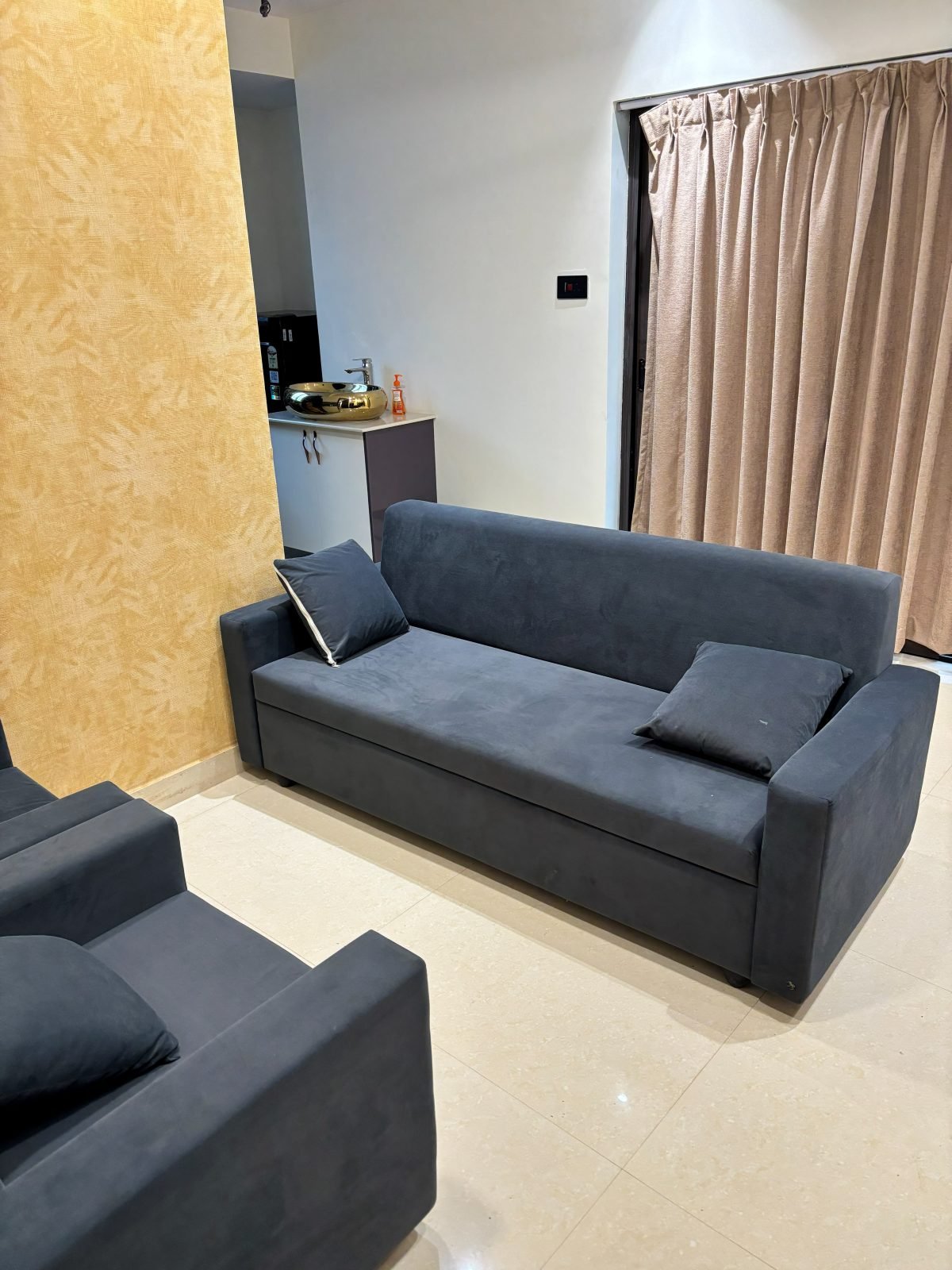 Lounge with a plush three-seater sofa